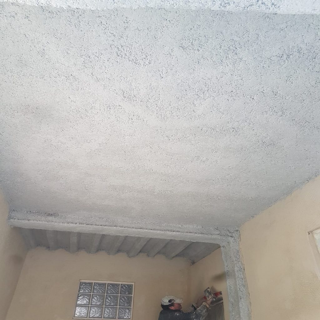 Flocage coupe-feu sur dalle béton