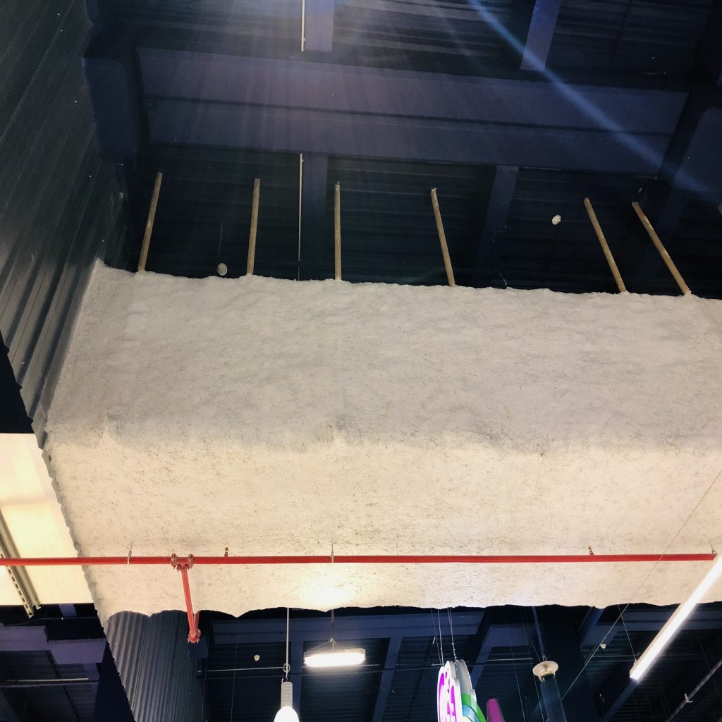 Isolation par projection pour entrepôts